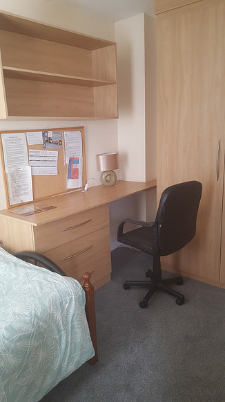 Room 2. Fully fitted wardrobes and desk.