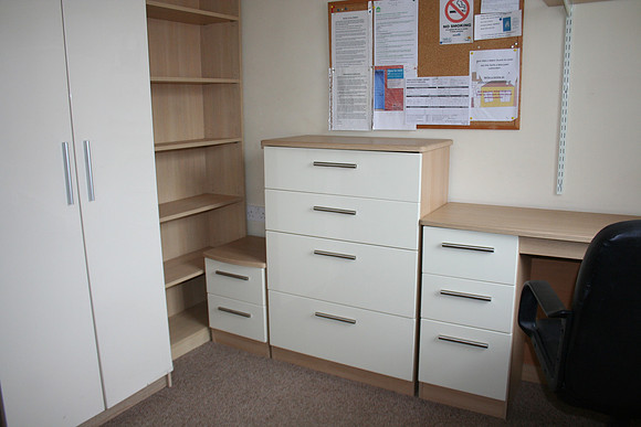 Room 4. Plenty of storage and lovely cream gloss furniture.