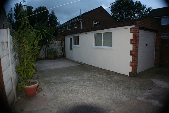 Outside detached utility room. Contains dryer and ironing facilities, plus large freezer.