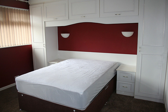 Room 2. Wall-to-wall units. Double bed.