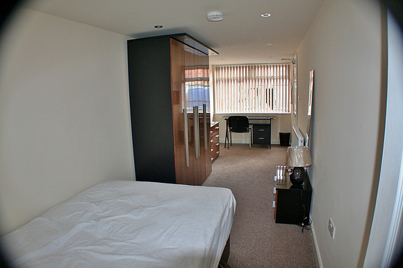 Room 1. Black glass desk.
